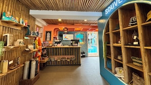 A souvenir shop with wooden shelves and a blue wall.