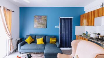 Design Apartment, 1 Bedroom | Living area | 43-inch Smart TV with cable channels, pay films