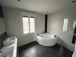 Jetted bath, hair dryer, towels, soap