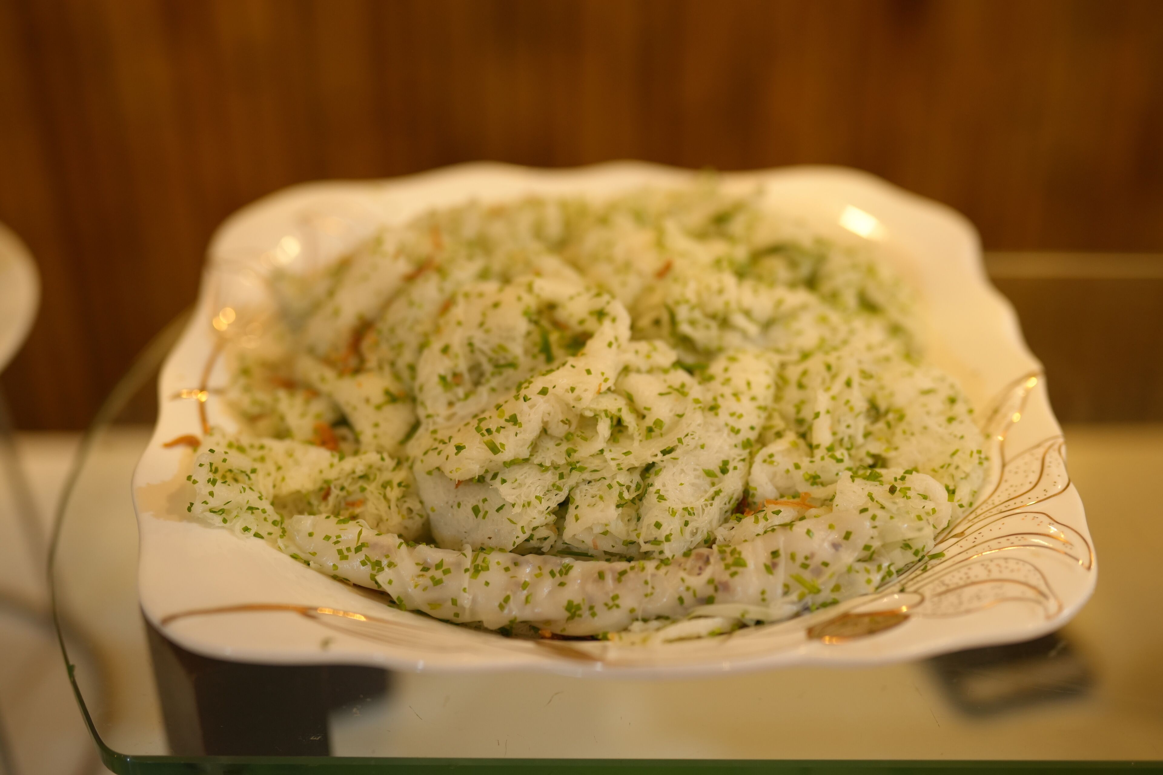 A plate of food with a decorative edge.
