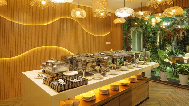 A buffet setup with various food containers and serving dishes. - Pleiku Hotel by Gia Lai Tourist (Pleiku)