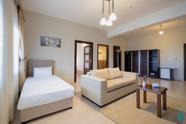 Family Suite | Living area | TV