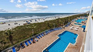 A resort with a pool area, beach access, and a view of the ocean. - Amazing Baywatch 3BR with Pools Direct Ocean Front (North Myrtle Beach)