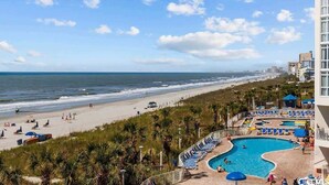A resort with a pool, beach, and ocean view. - Amazing Baywatch 3BR with Pools Direct Ocean Front (North Myrtle Beach)