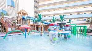 A water park area with a pool, slides, and play structures. - Amazing Views, Coastal  Paradise Experience! (Myrtle Beach)