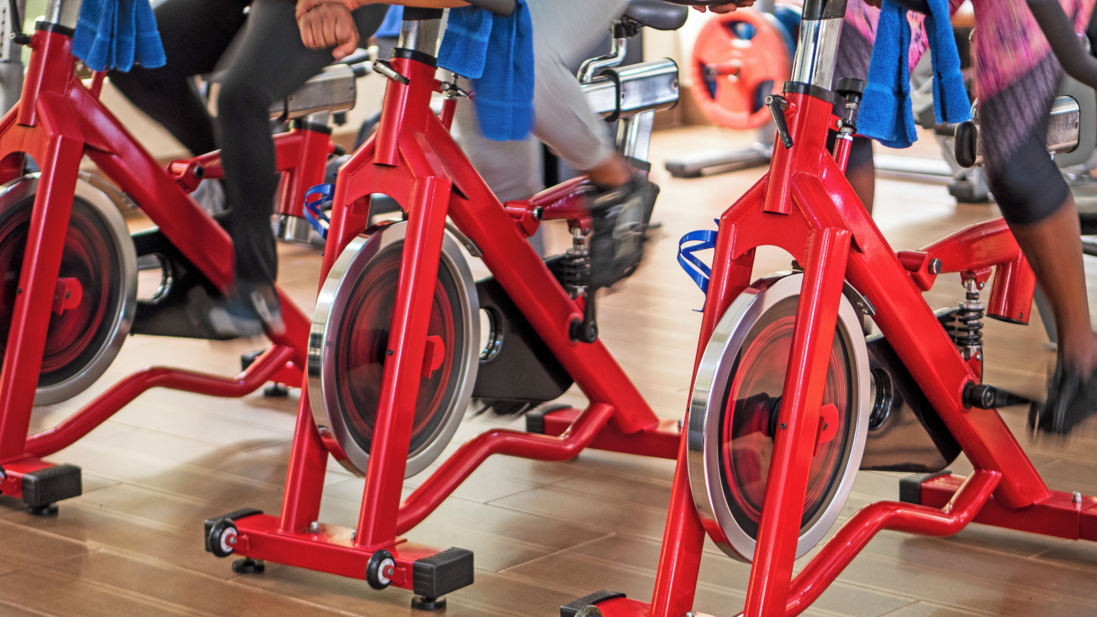 Stationary exercise bikes in a gym setting.