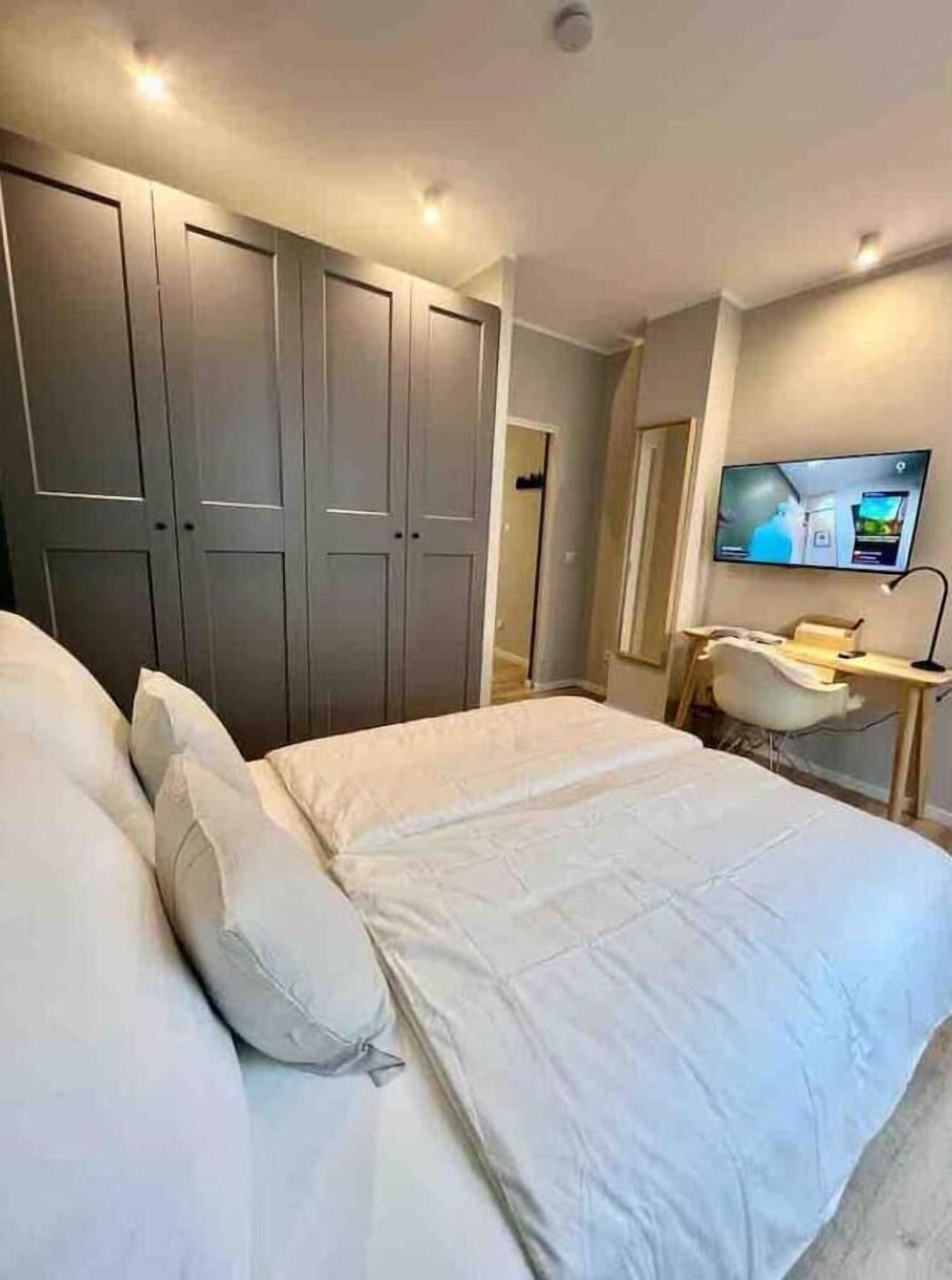 1 bedroom, desk, iron/ironing board, travel crib