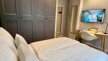 1 bedroom, desk, iron/ironing board, travel crib