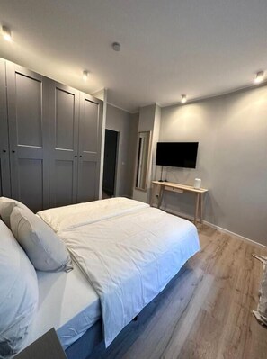 1 bedroom, desk, iron/ironing board, travel crib