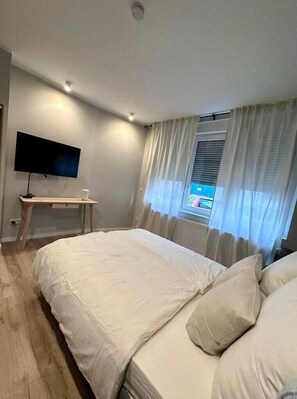 1 bedroom, desk, iron/ironing board, travel cot