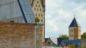Un edificio histórico con una imponente aguja verde y una torre más pequeña.