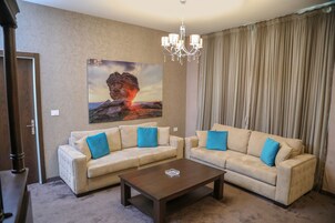 Family Suite | Living area | Flat-screen TV, printers