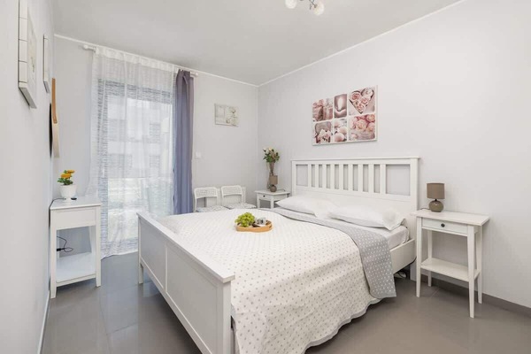 The cosy bedroom features a luxurious double bed and ample storage.