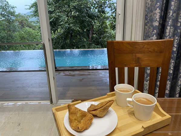 Dining - A 4 BHK VILLA WITH A PRIVATE INFINITY POOL SURROUDED BY SERENE HILLS (Chavani)