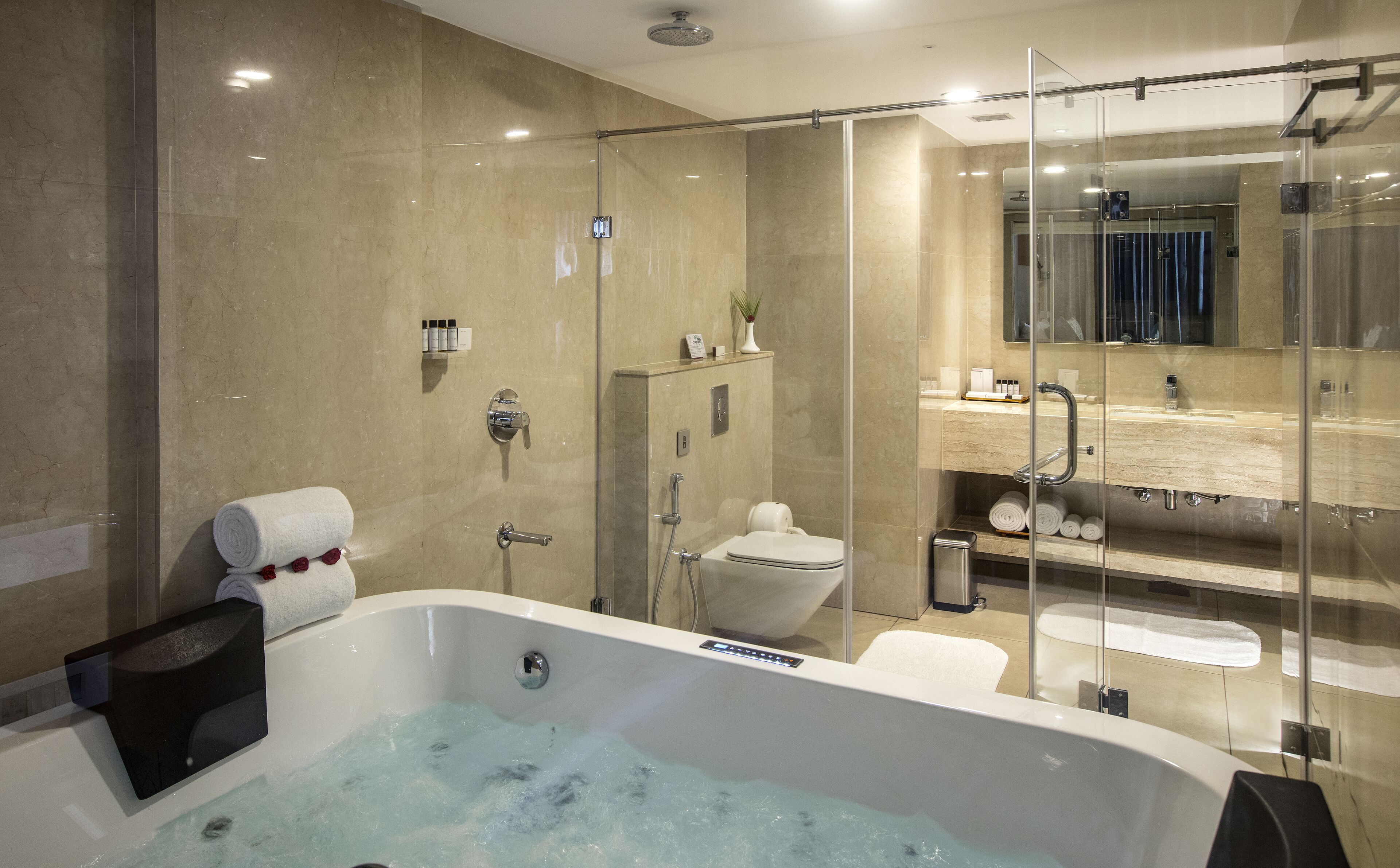Splash Junior Suite | Bathroom | Hair dryer, slippers, towels, soap