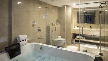 Splash Junior Suite | Bathroom | Hair dryer, slippers, towels, soap