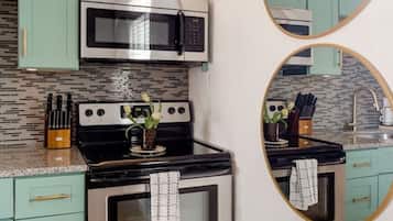 Fridge, coffee/tea maker, cookware/dishes/utensils