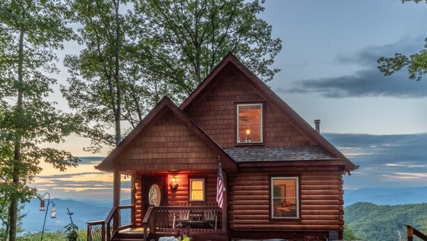 A rustic log cabin with a porch, a small deck, and a view of the mountains. - Majestic Views-Hot Tub - Views - Gas Firepit -4WD-AWD (Whittier)