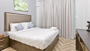 Appartement Confort | 1 chambre, ameublement personnalisé, fer et planche à repasser
