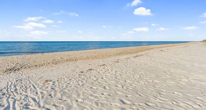 Beautiful St.George Island pool home, large patio pool surround & fire pit area.
