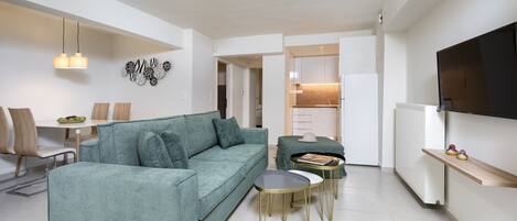 Comfort Apartment, 1 Bedroom, Garden View | Living area | 40-inch Smart TV with digital channels, fireplace