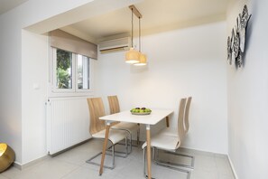 Comfort Apartment, 1 Bedroom, Garden View | Living area | 40-inch Smart TV with digital channels, fireplace