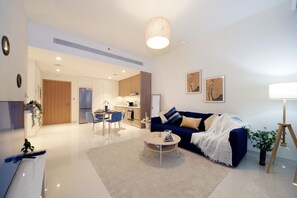 Elite Apartment | Living area | 50-inch Smart TV with cable channels - Luxury StayCation - Beachfront Apartment With Fantastic Palm Views  (Dubai)