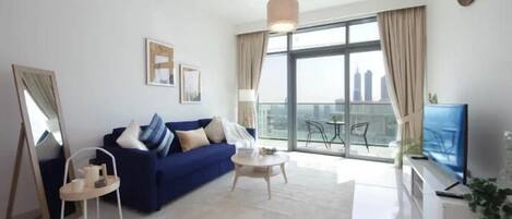 Elite Apartment | Living area | 50-inch Smart TV with cable channels