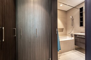 Classic Apartment | Bathroom | Bathtub, hair dryer, towels, toilet paper - Luxury StayCation - Fancy Apartment Connected To Burj Khalifa  (Dubai)