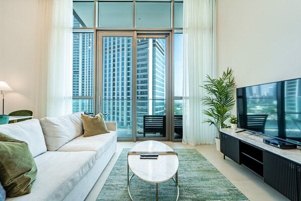 Classic Apartment | Living area | 50-inch Smart TV with cable channels - Luxury StayCation - Fancy Apartment Connected To Burj Khalifa (Dubai)