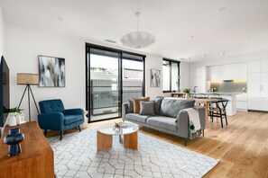 Two Bedroom Apartment With Parking | Living area | Smart TV - Docker St Elwood Apartments by UrbanRest (Elwood)