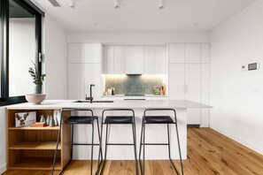 Two Bedroom Apartment With Parking | Private kitchen | Full-size fridge, microwave, oven, stovetop - Docker St Elwood Apartments by UrbanRest (Elwood)