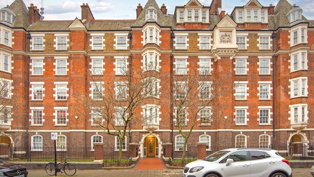 A large, historic building with multiple windows and a central entrance. - Central London apartment (London)