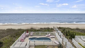 A pool area with a view of the beach and ocean. - Blue View, Oceanfront House in Pine Knoll Shores, NC! (Pine Knoll Shores)