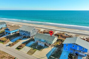 A coastal residential area with houses and a beach. - Captain's Quarters West, Oceanfront Duplex in Emerald Isle, NC! (Emerald Isle)