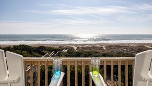 A balcony with a view of the ocean and beach. - Angel's at the Pier West - Oceanfront Duplex in Emerald Isle, NC! (Emerald Isle)