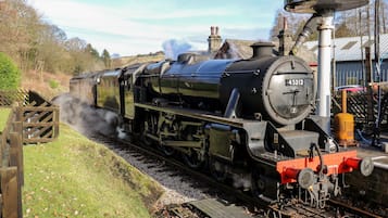 A steam locomotive with the number 45212 on a railway track.
