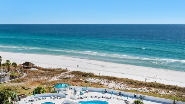 A beachside resort with a swimming pool, lounge chairs, and a view of the ocean. - 🚢Beachfront Complex-Private Beach-Incredible Gulf Views-Edgewater #1007🚢 (Miramar Beach)