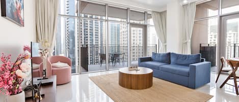 Deluxe Apartment | Living area | 55-inch Smart TV with cable channels, Netflix, streaming services