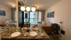 Enjoy meals in style with a dining table set for four and comfortable seating.