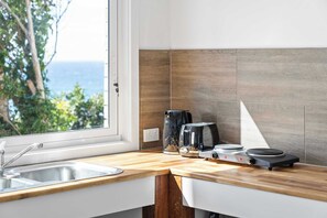 Fridge, microwave, toaster, cookware/dishes/utensils