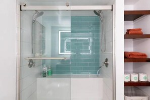 Shower, hair dryer, towels, soap