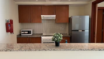 Fridge, microwave, oven, cookware/dishes/utensils