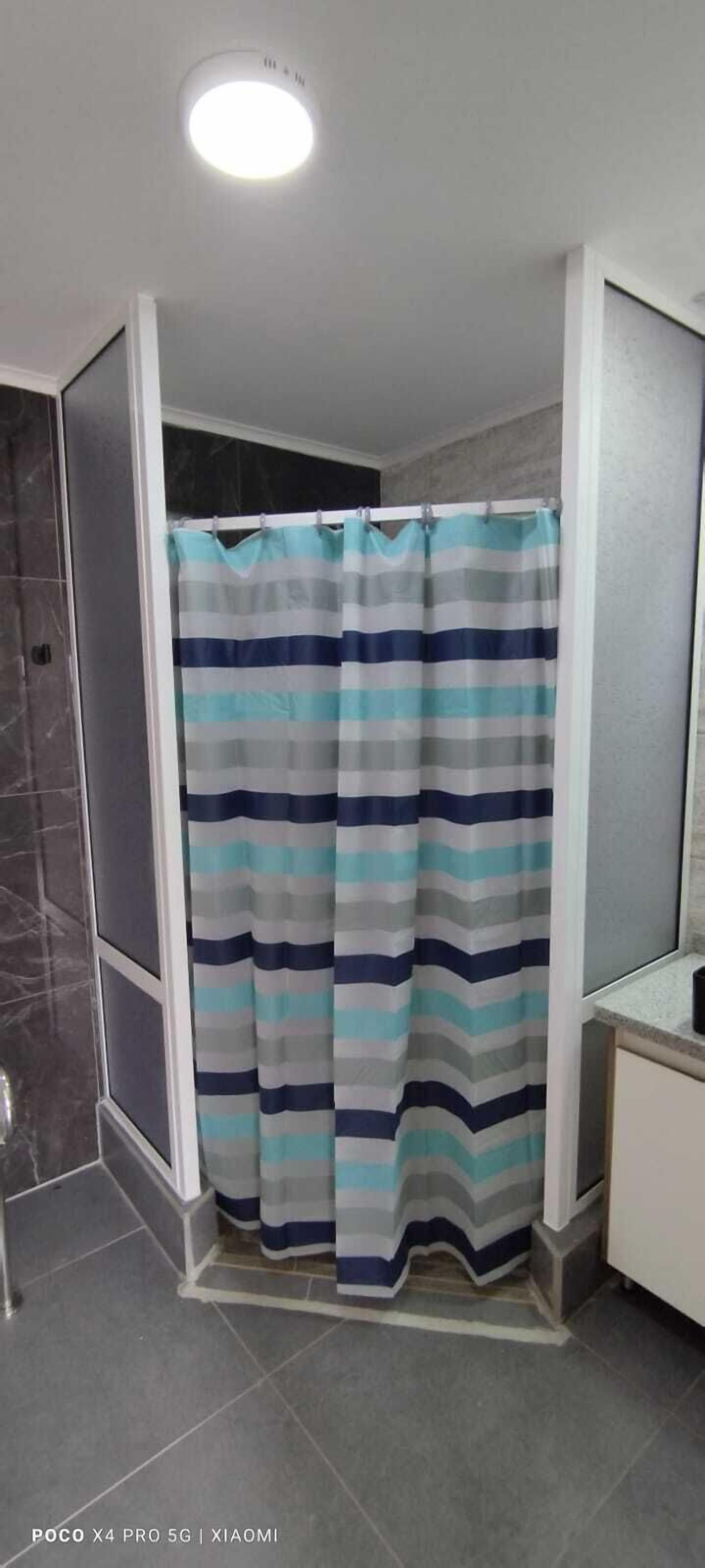 Shower, rainfall showerhead, towels, soap