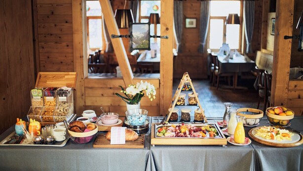 A breakfast buffet with various food items and condiments. - Gasthaus Hof (Appenzell)