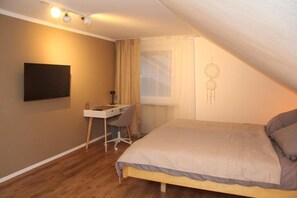 1 bedroom, desk, iron/ironing board, travel cot