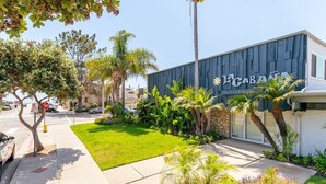 A building with a dark facade and a sign that reads 'CABANA.' - Sandyland Beach Studio Carpinteria (Carpinteria)