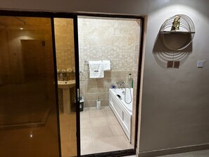 Separate bathtub and shower, rainfall showerhead, slippers, bidet - Osmosis Ikoyi (Lagos)
