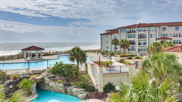 A resort with a pool, a gazebo, and a view of the ocean. - North Topsail Beach Condo in Resort-Style Complex! (North Topsail Beach)