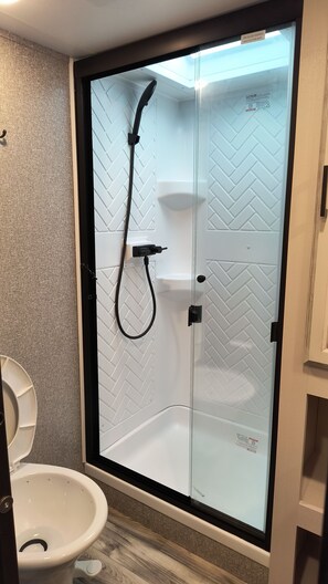 Shower, hair dryer, towels, soap